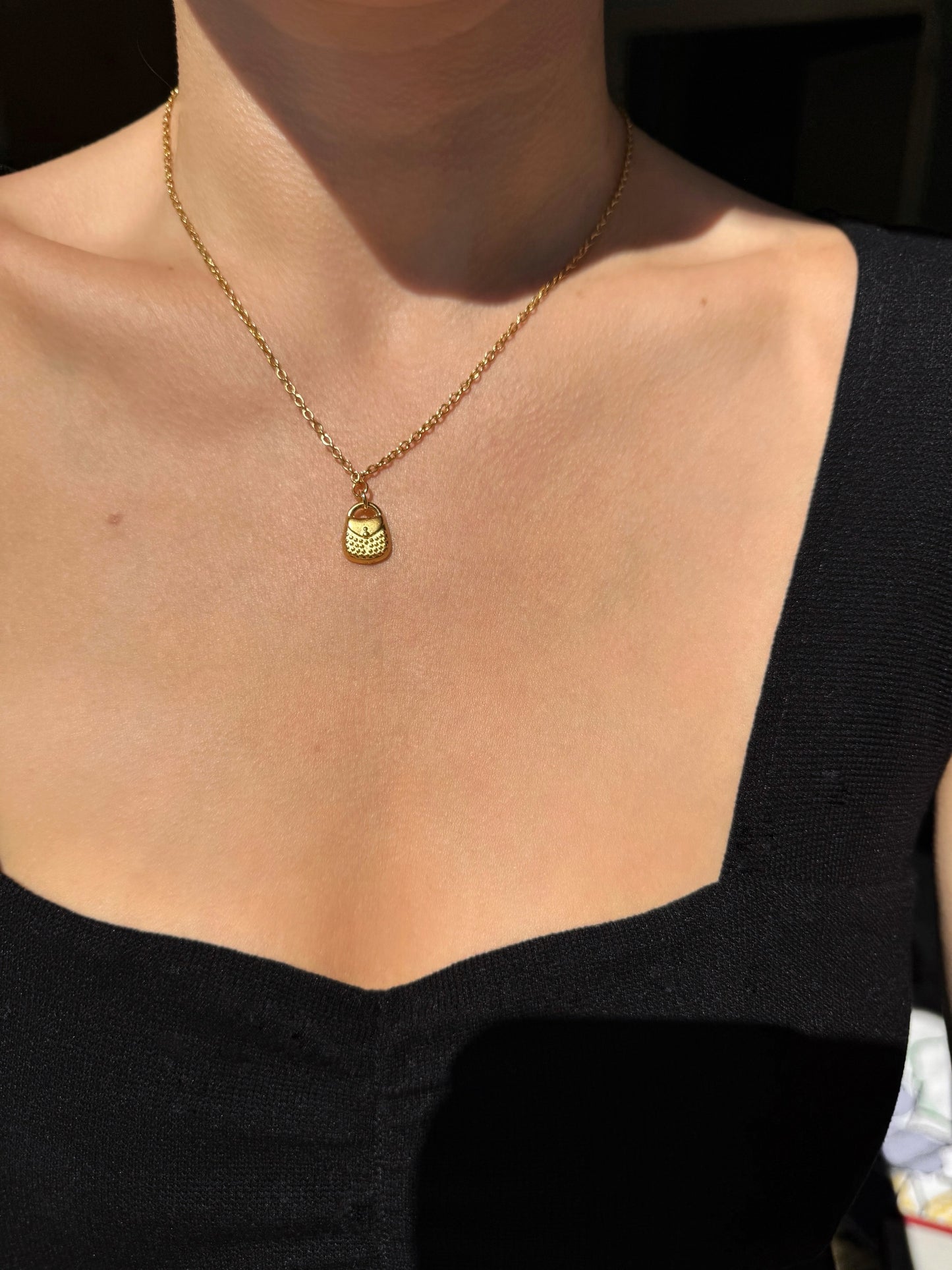 Gold multi-charm necklace
