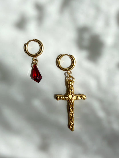 Mismatched cross earrings