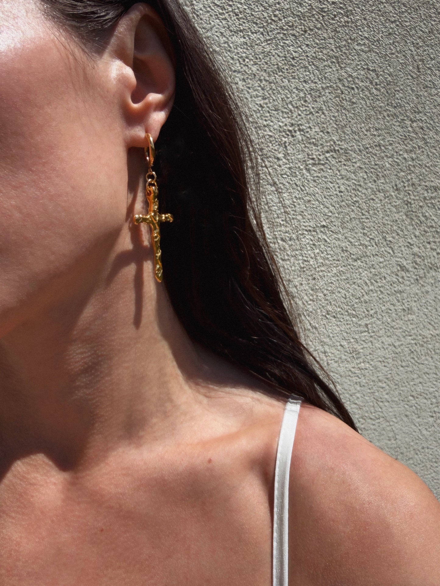 Mismatched cross earrings