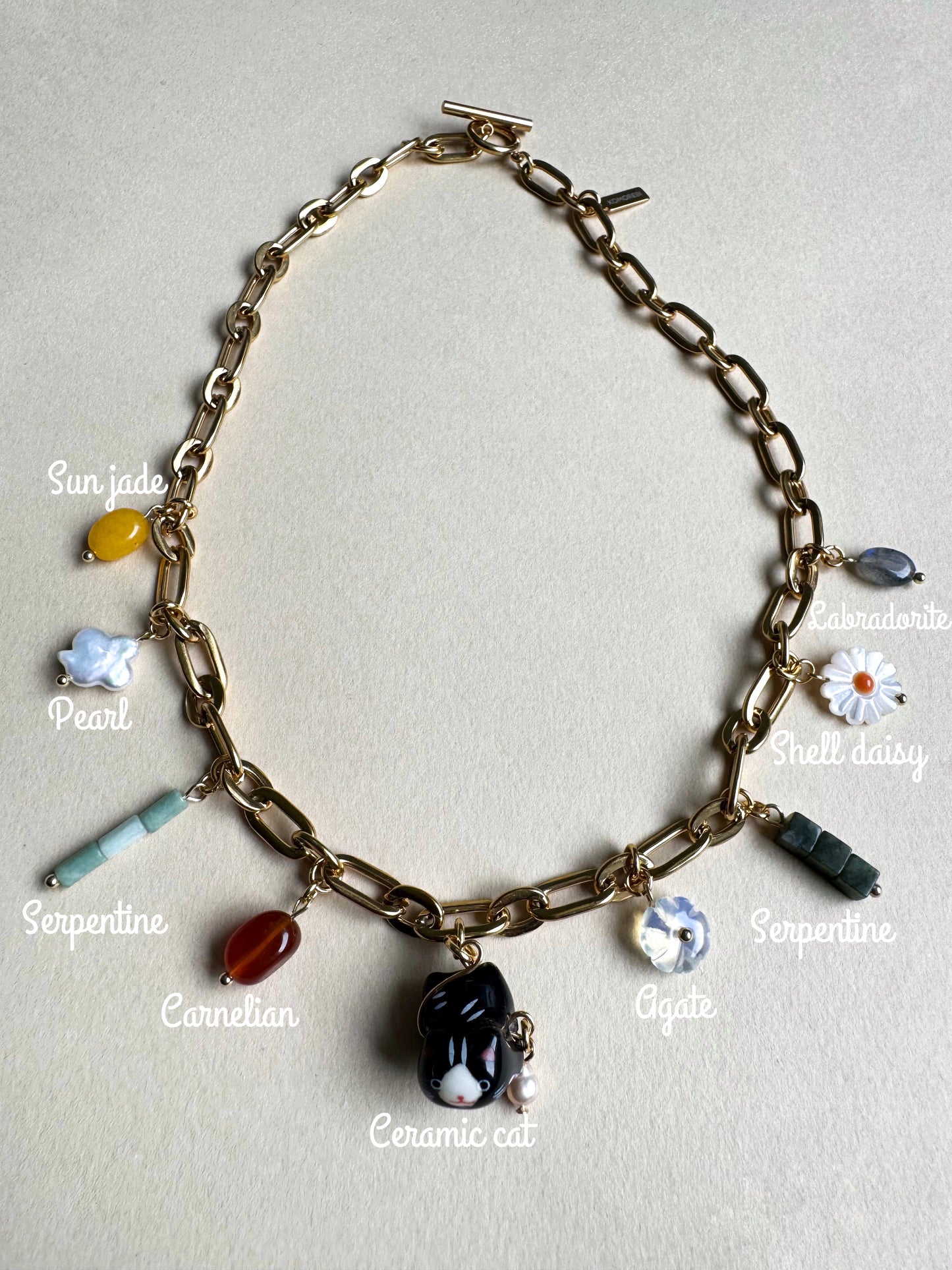 Gold multi charm necklace